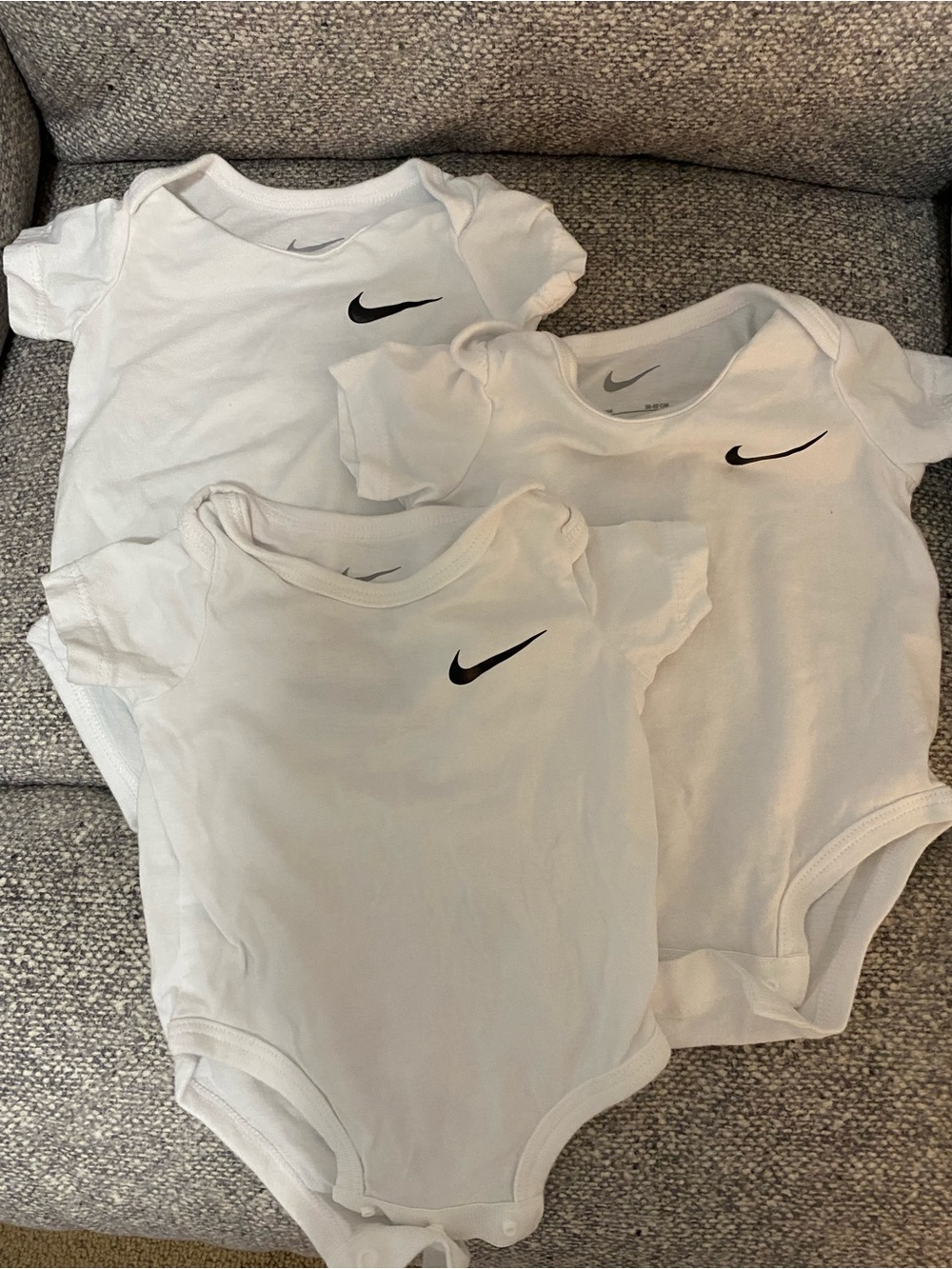 Nike White Infant Short-Sleeve One-Piece Bodysuits with Black Swoosh